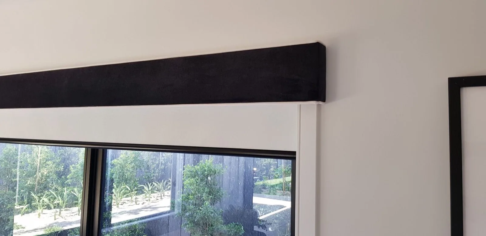 Black pelmet roller blind closeup installation by SupaScreens.
