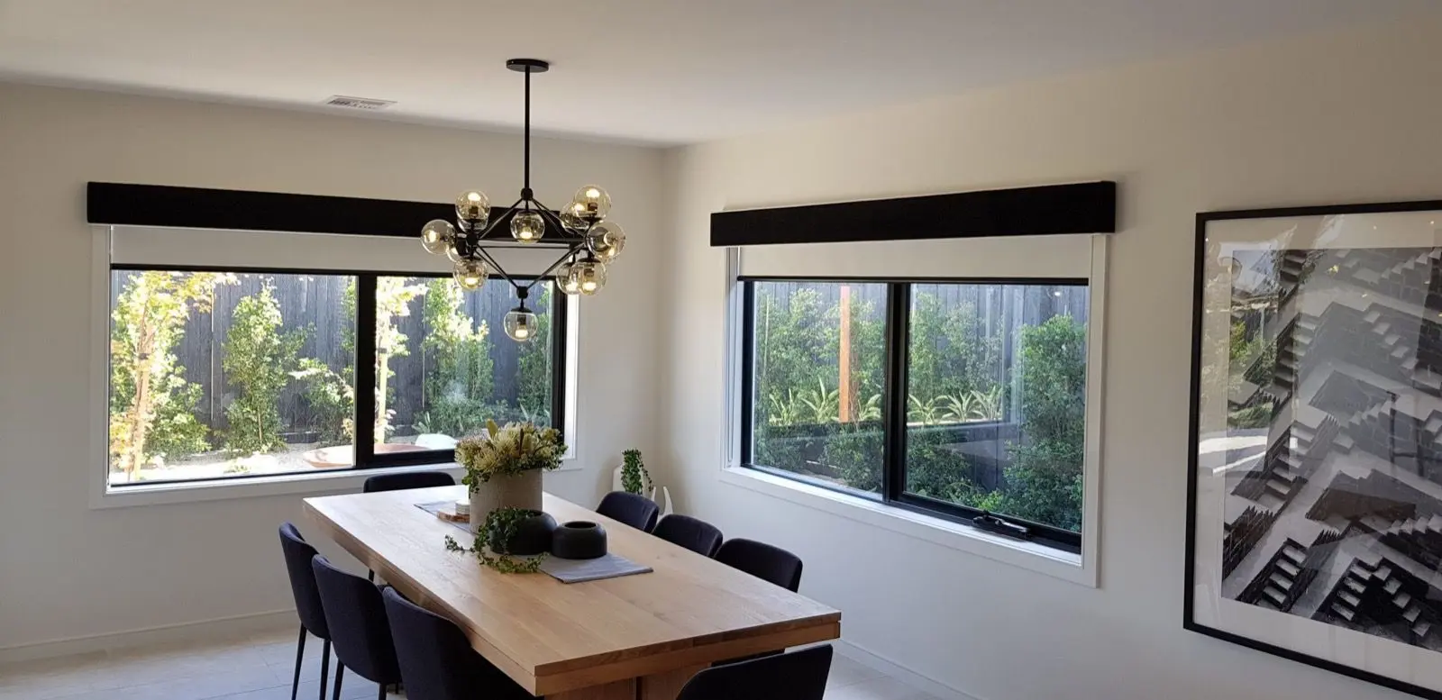 Black pelmet roller blinds dining installation by SupaScreens.