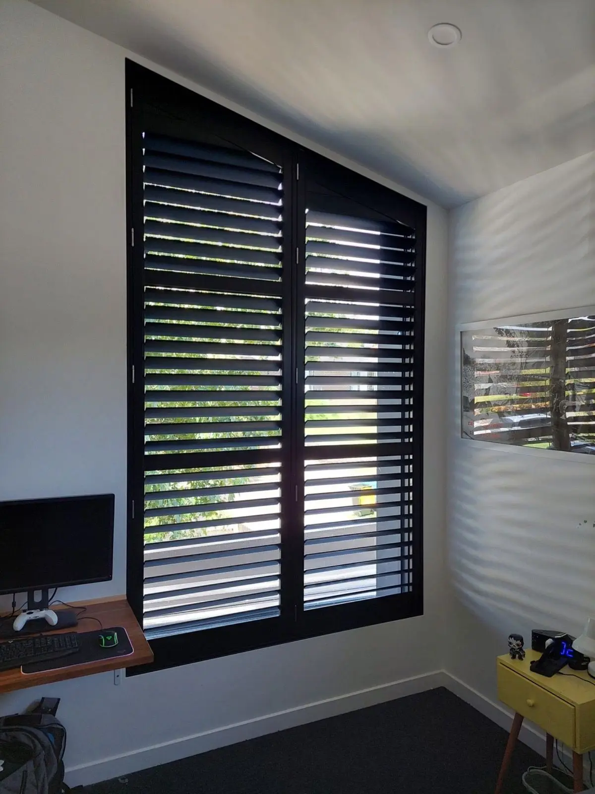 Black plantation shutters office installation by SupaScreens.