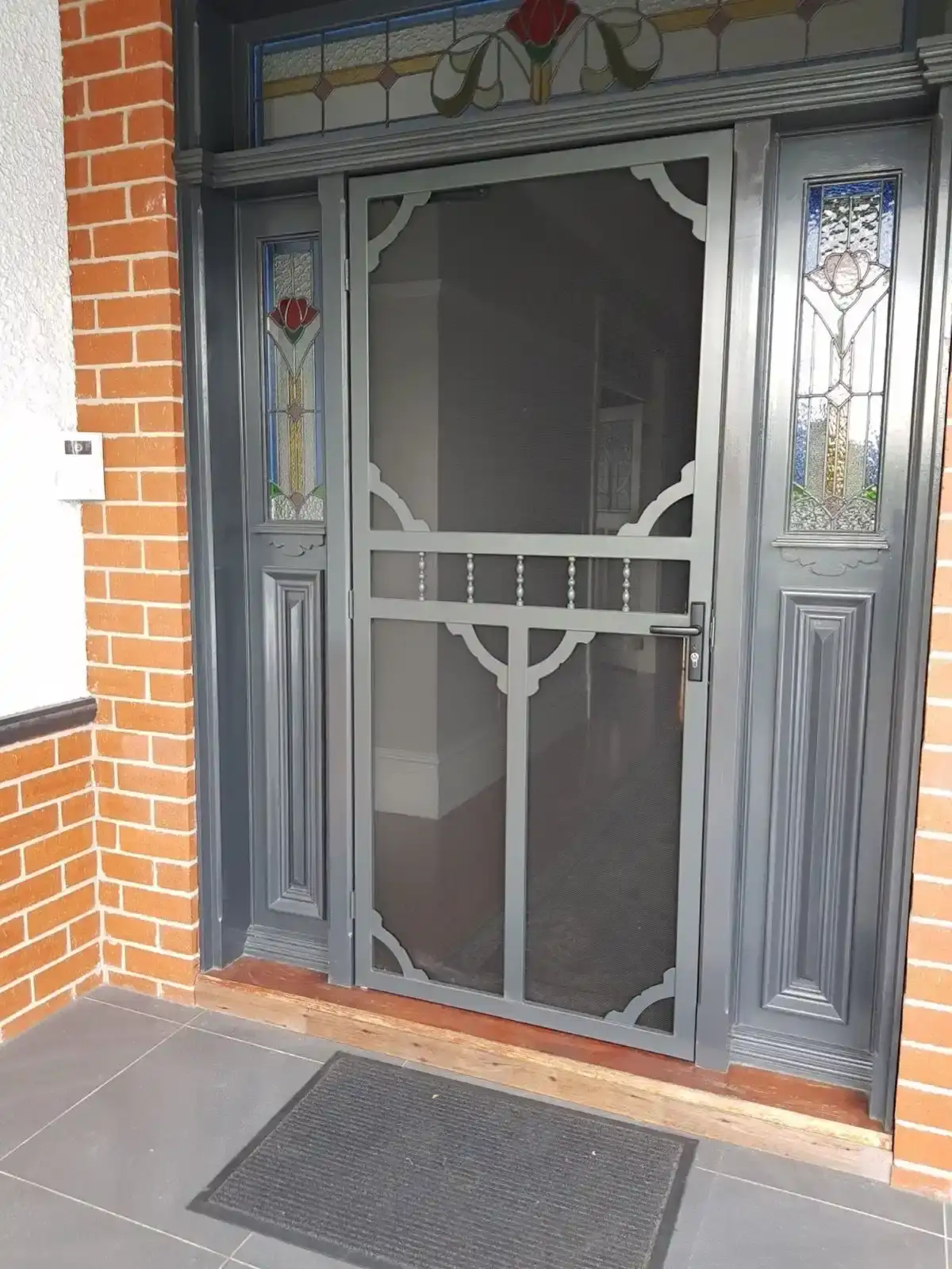 Grey decorative security door installation by SupaScreens.