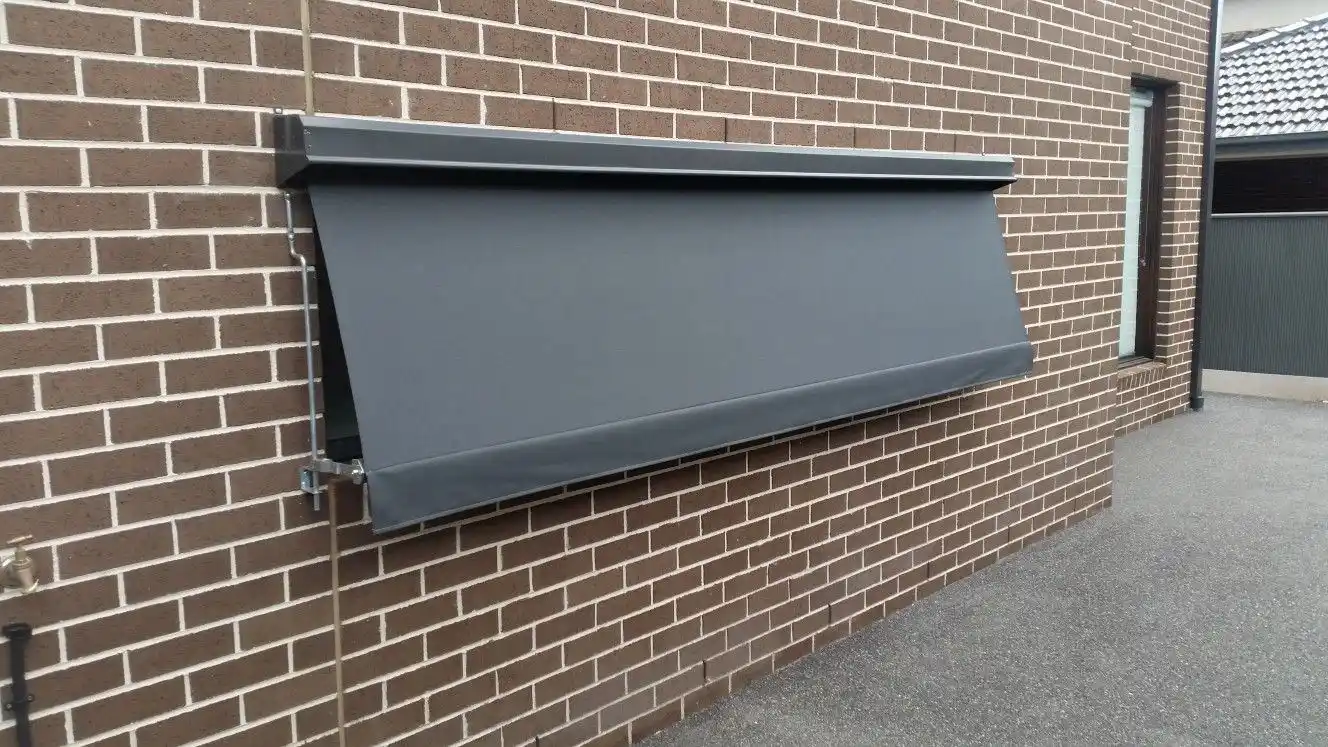 Outdoor blind brick house installation by SupaScreens.