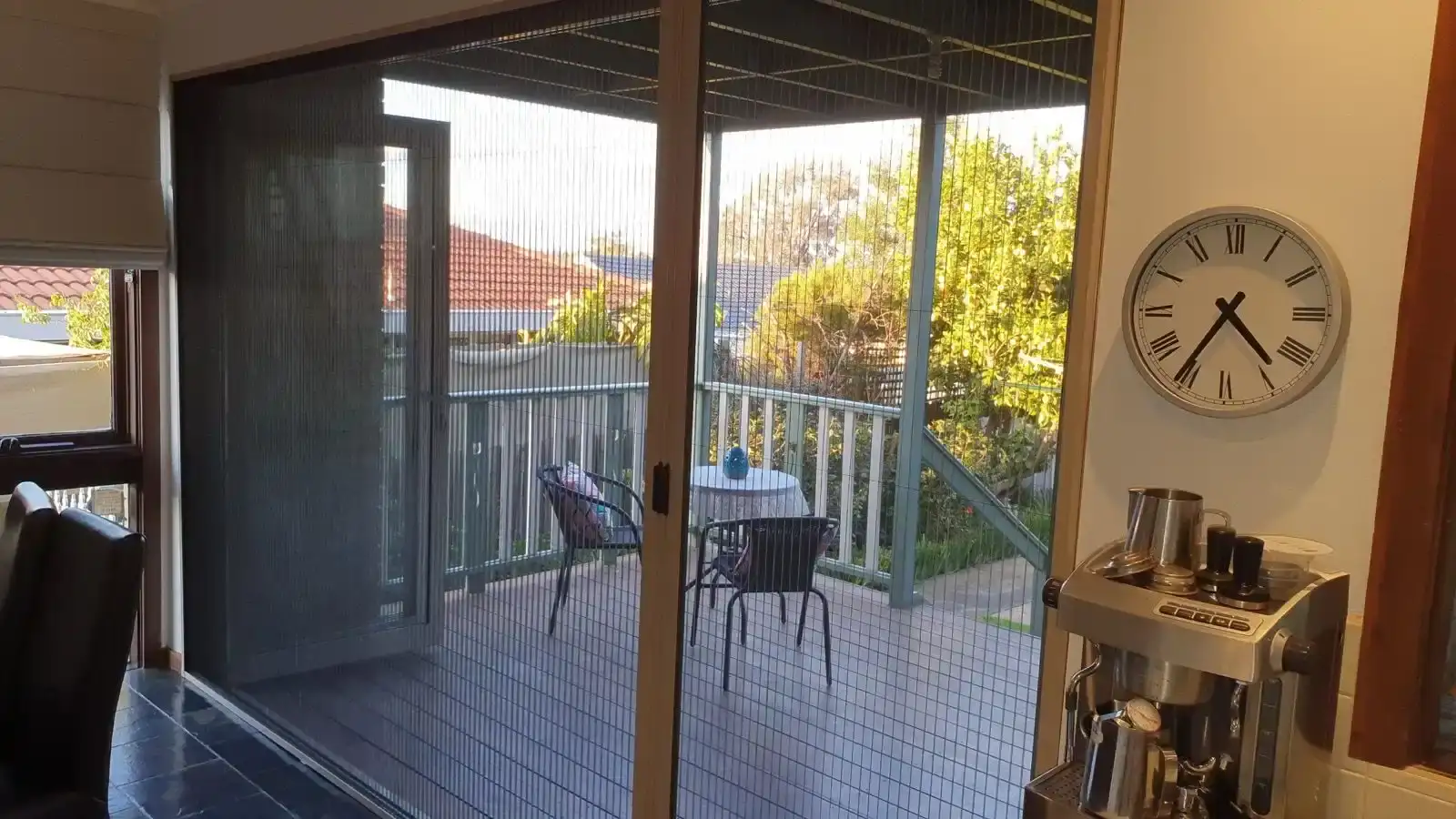 Retractable door screen balcony installation by SupaScreens.