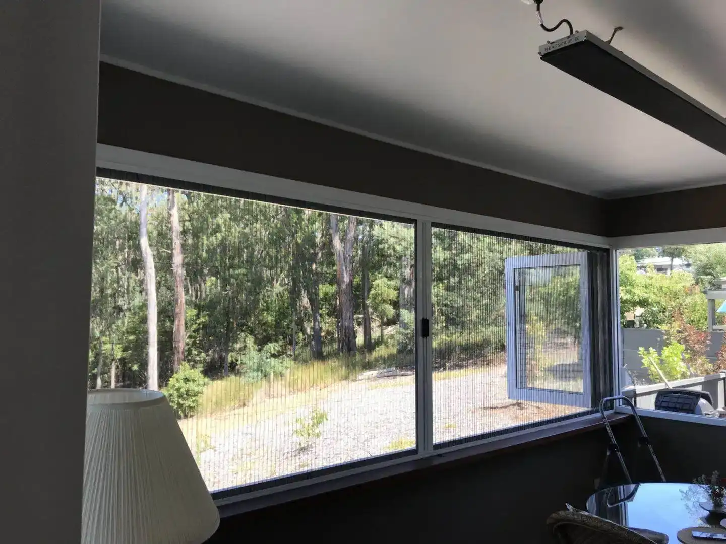 Retractable window screen sunroom installation by SupaScreens.