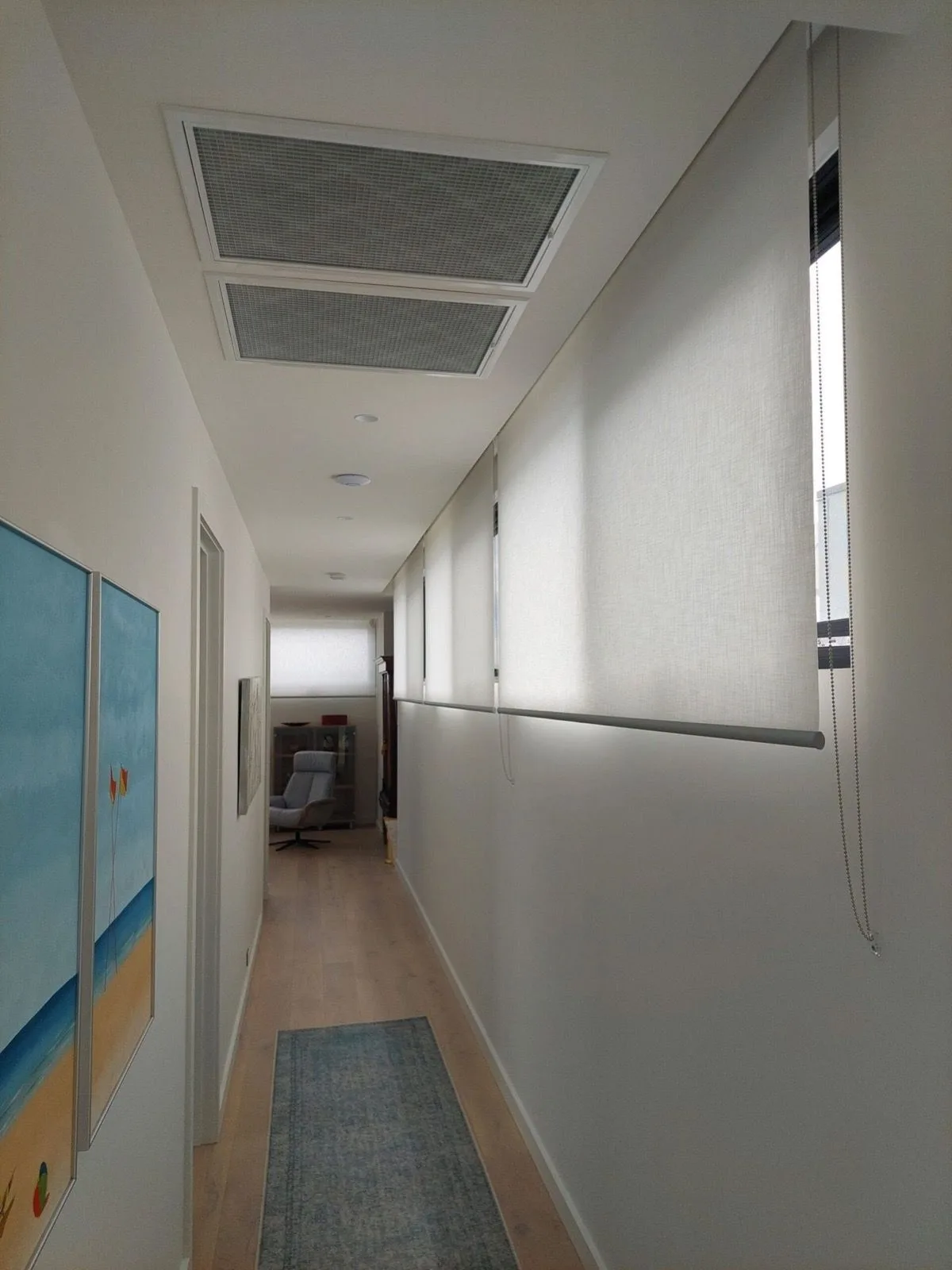 Roller blinds hallway windows installation by SupaScreens.