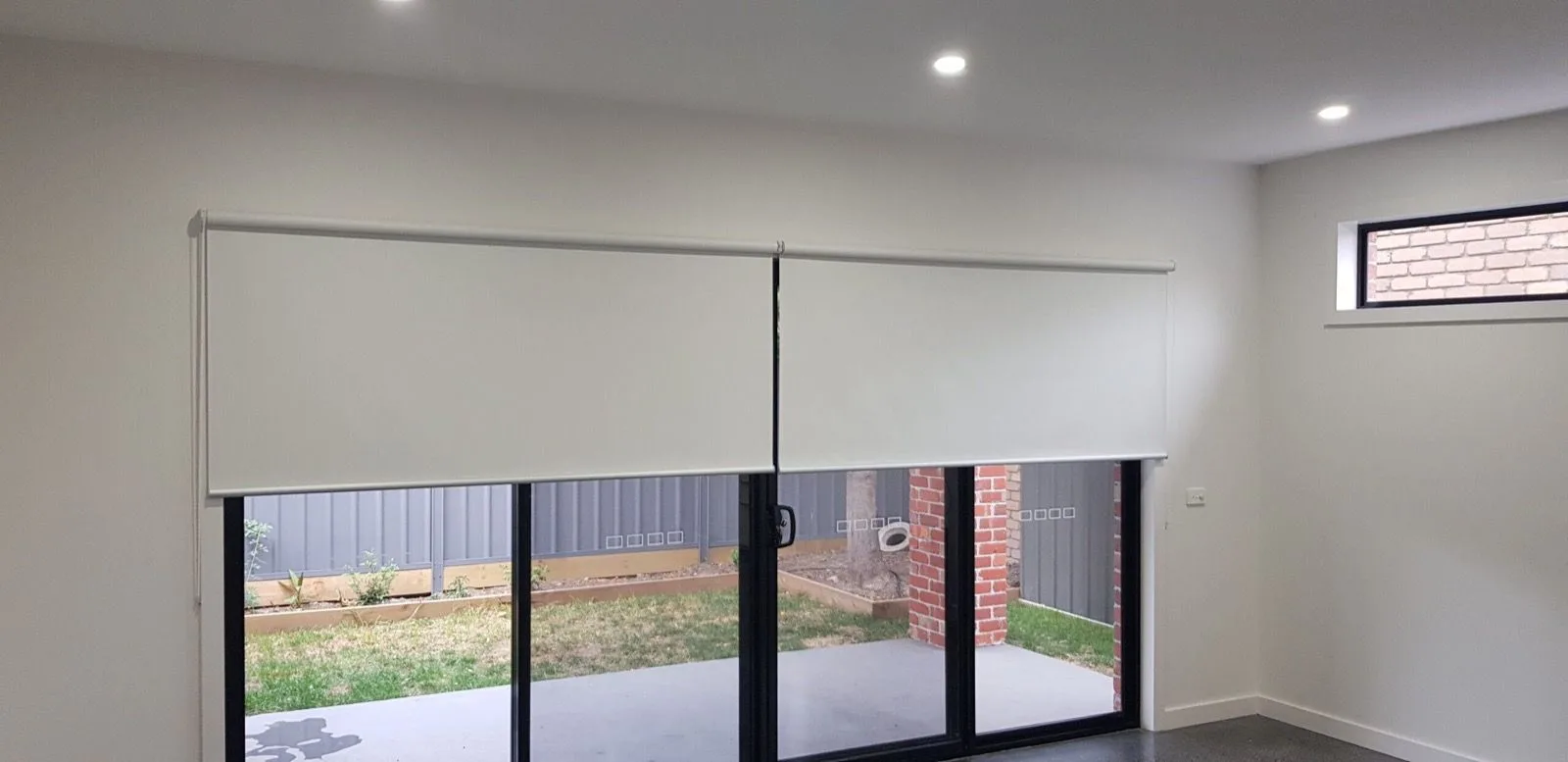 Roller blinds sliding glass doors installation by SupaScreens.
