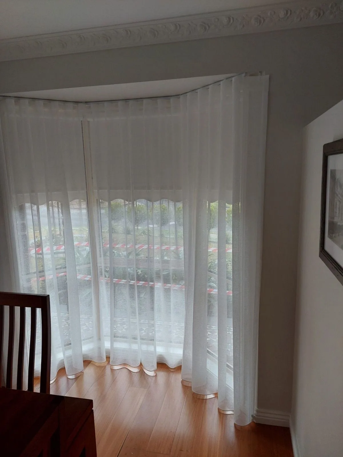 Sheer curtains bay window dining installation by SupaScreens.