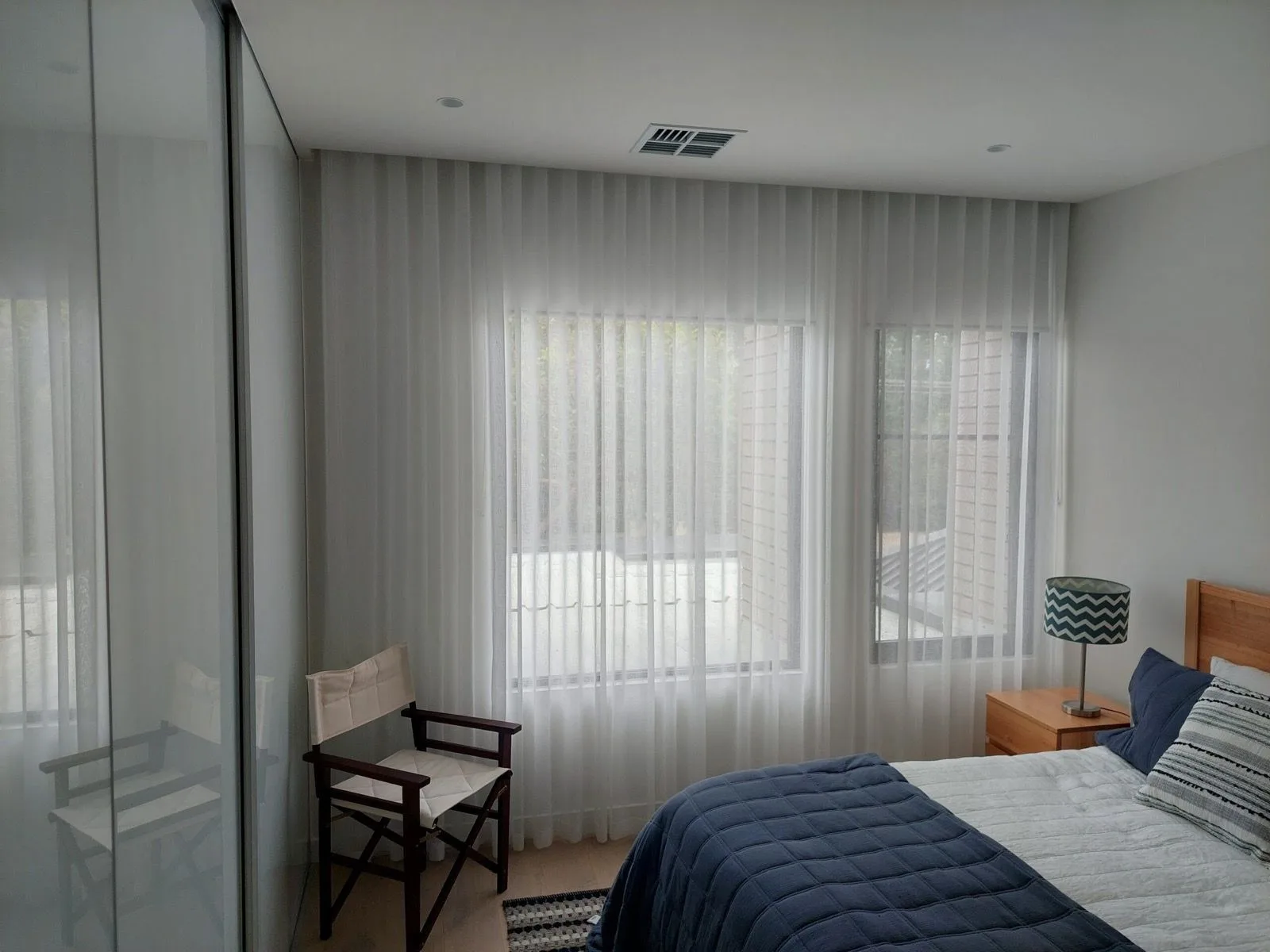 Sheer curtains bedroom window installation by SupaScreens.