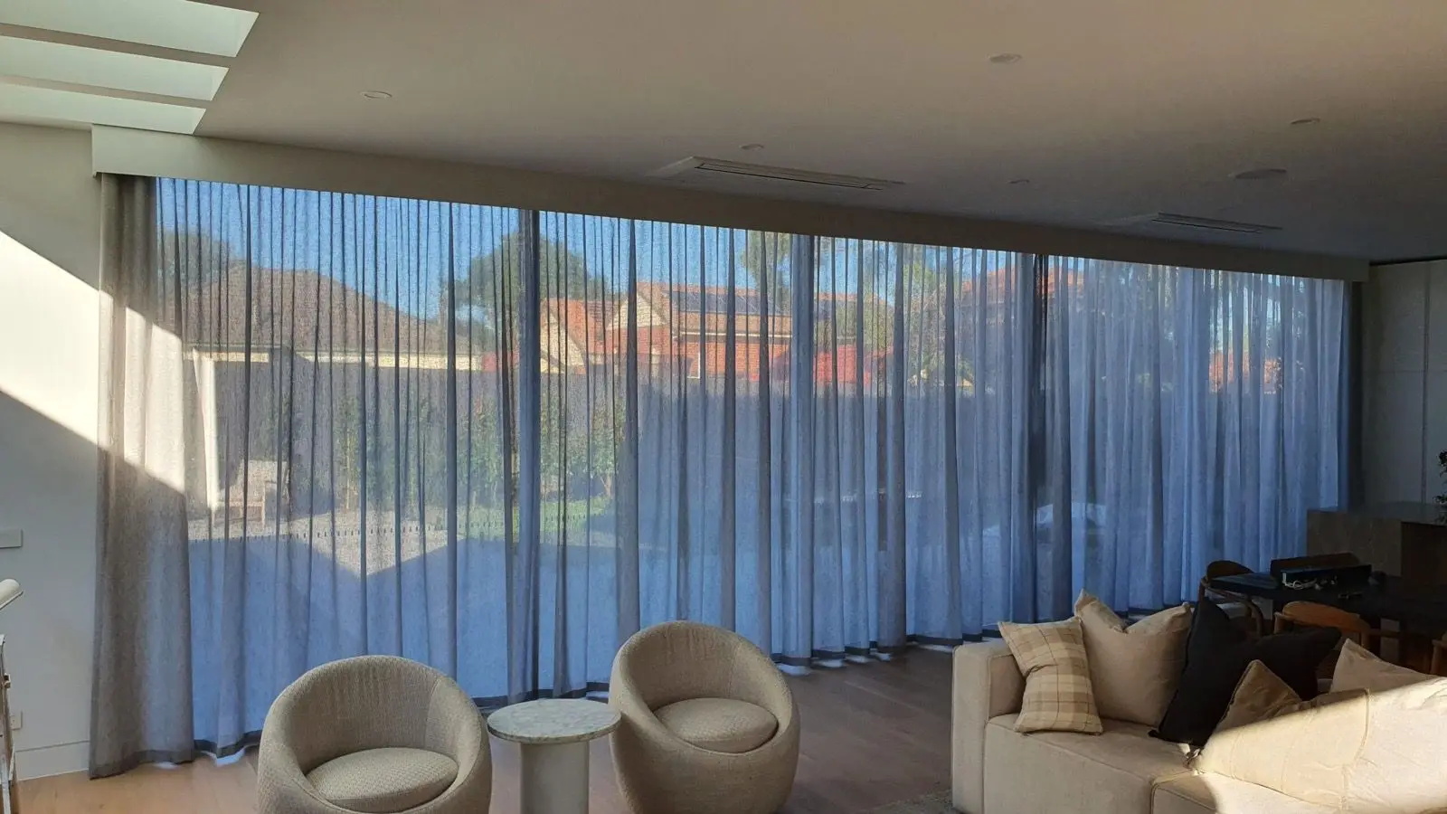 Sheer curtains living room skylight installation by SupaScreens.