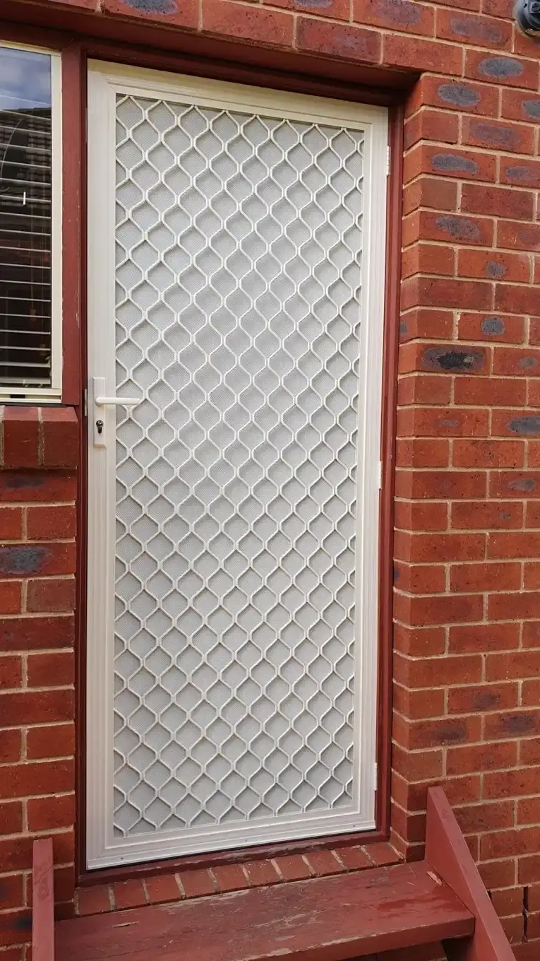 White diamond grille security door installation by SupaScreens.