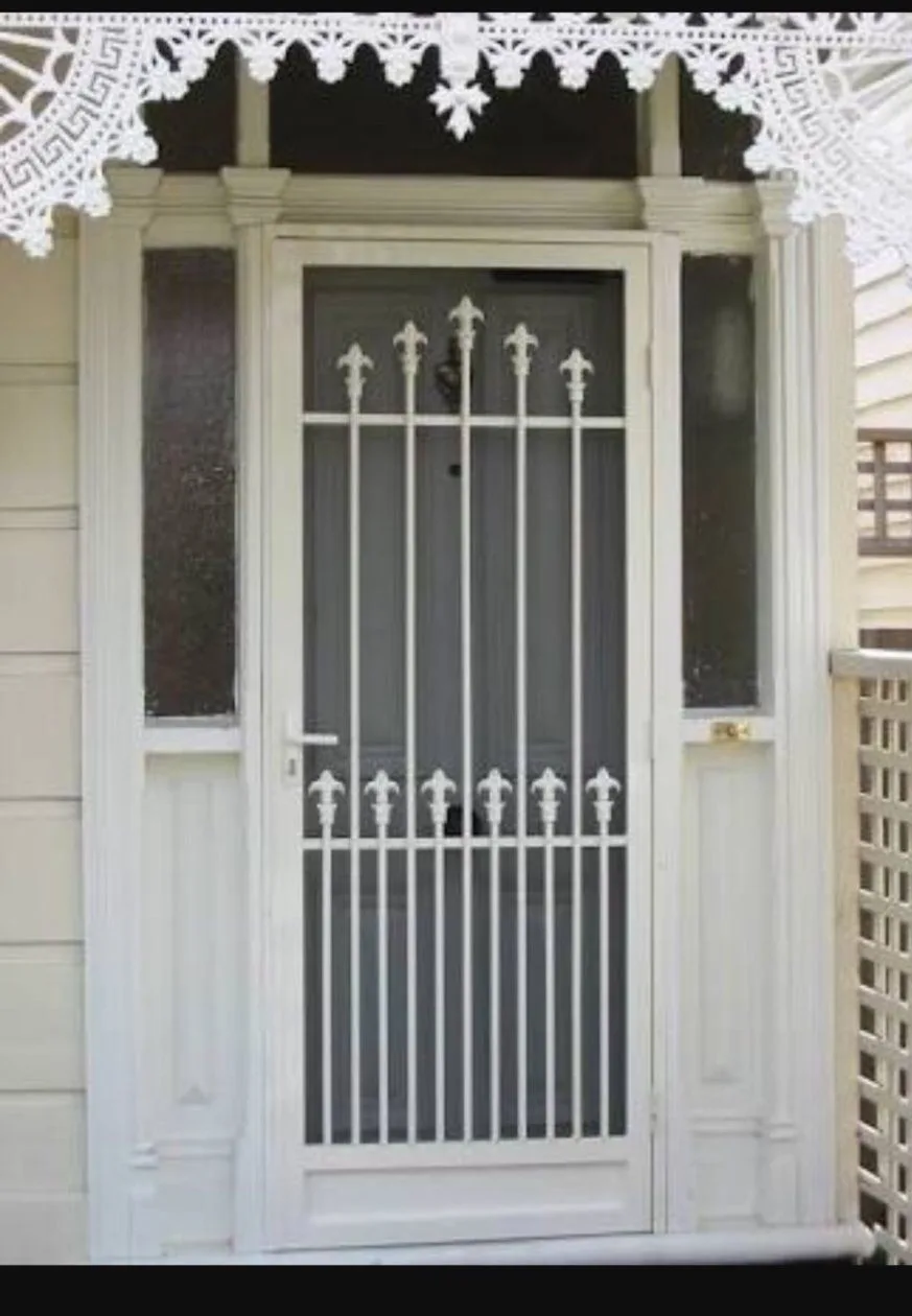 White ornate security door installation by SupaScreens.