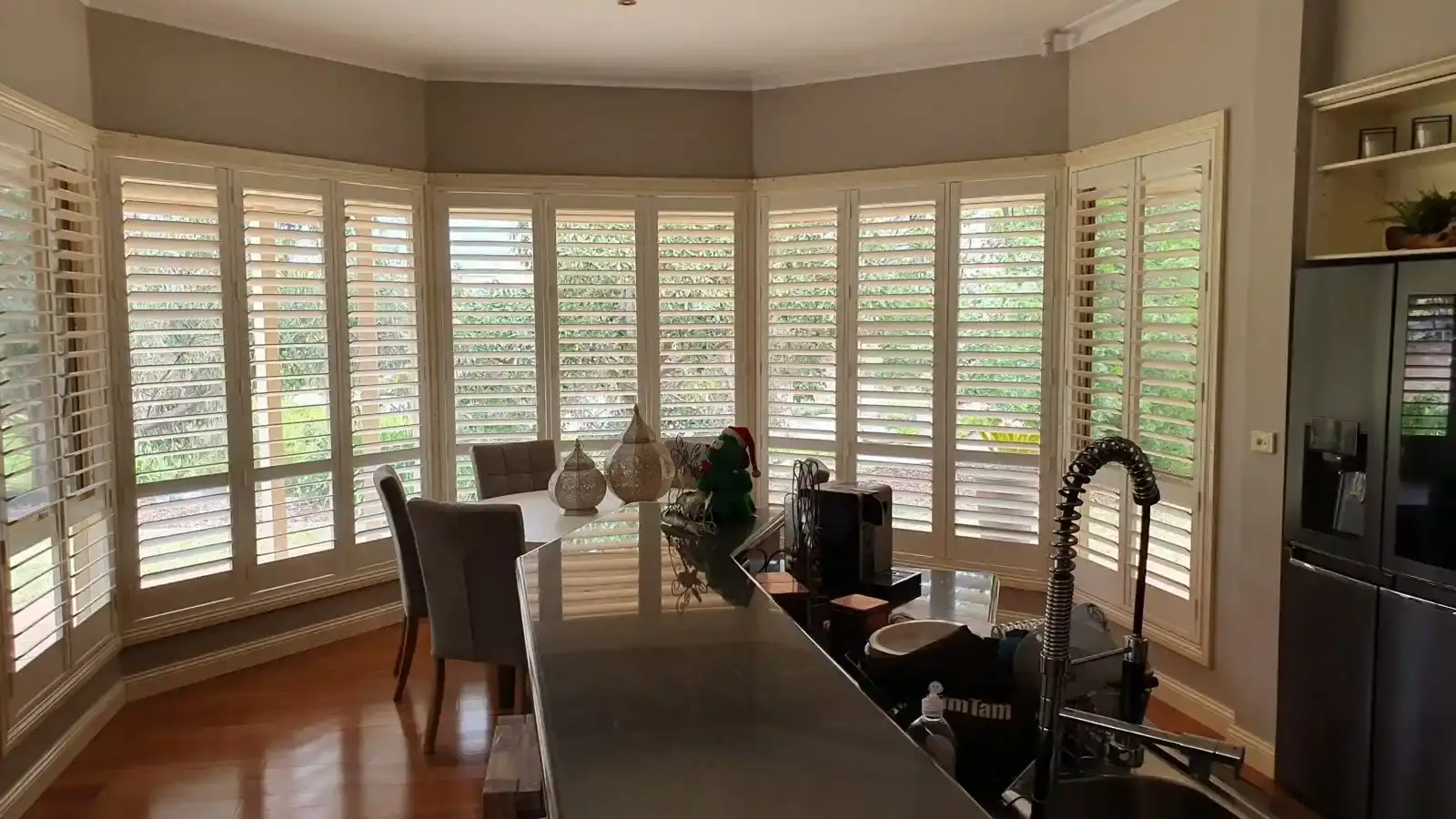 White plantation shutters bay window installation by SupaScreens.