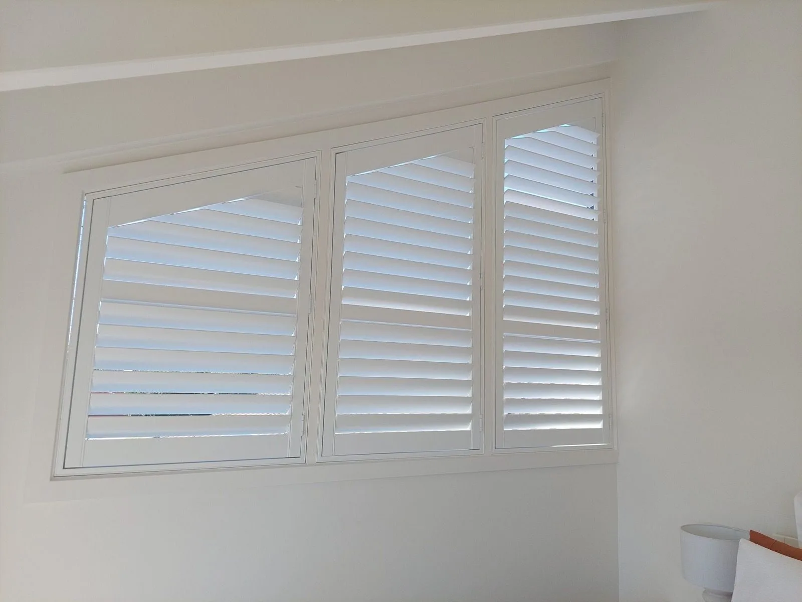 White plantation shutters bedroom installation by SupaScreens.