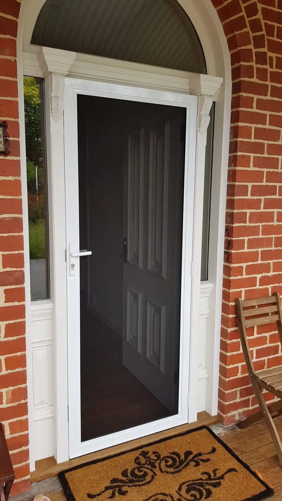 White security door arched porch installation by SupaScreens.