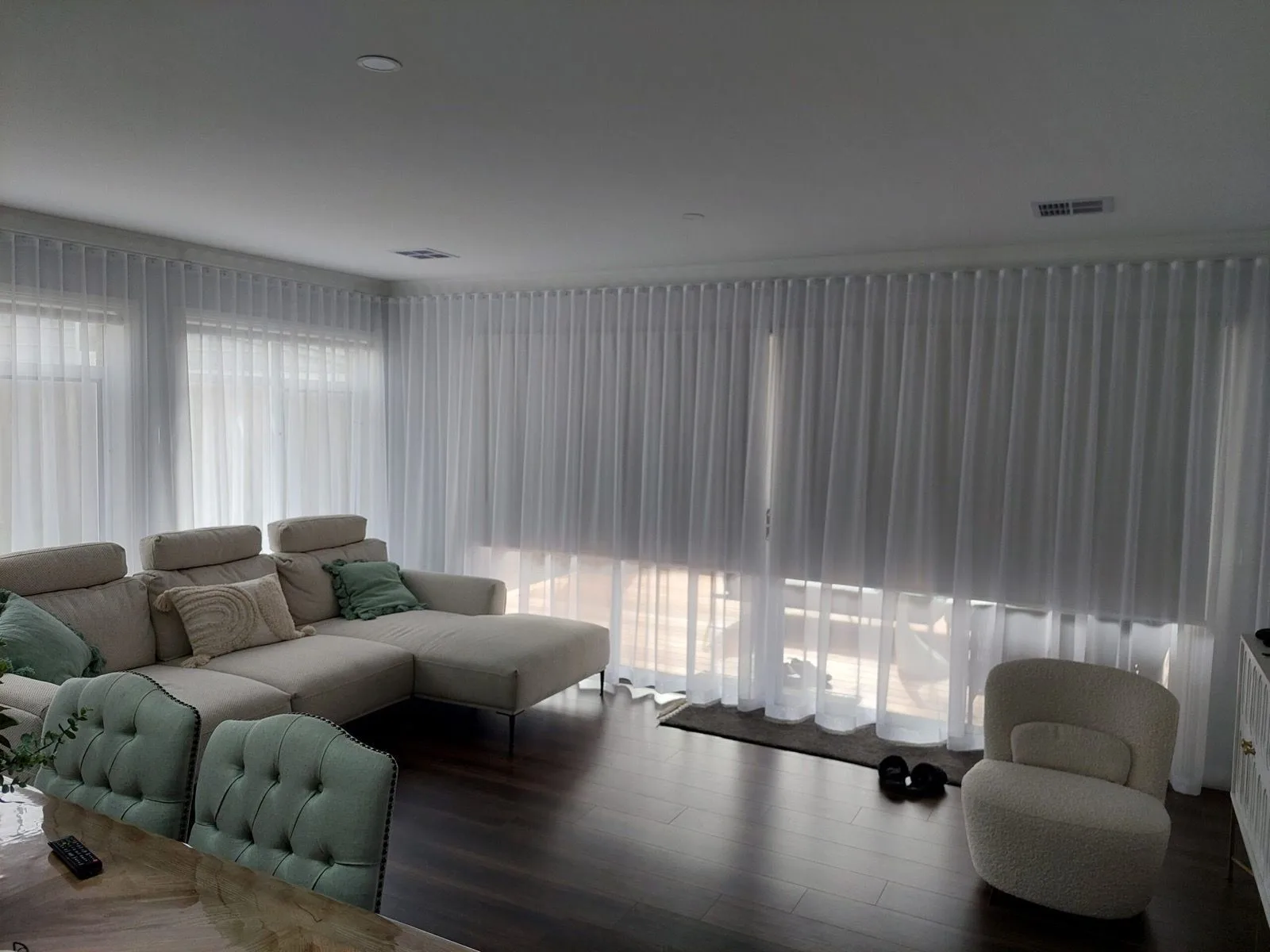 White sheer curtains living room installation by SupaScreens.