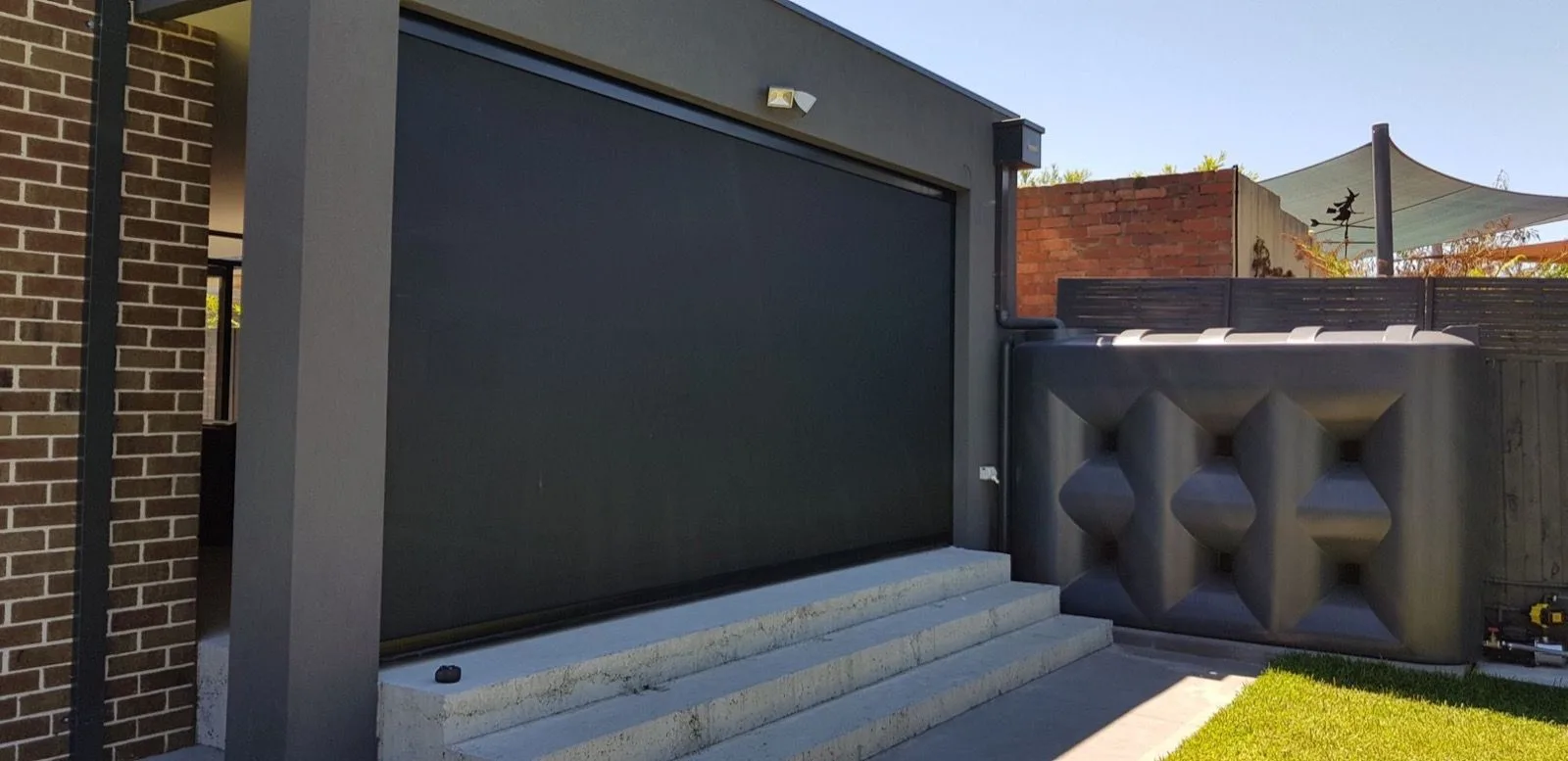 Outdoor blind closed carport installation by SupaScreens.